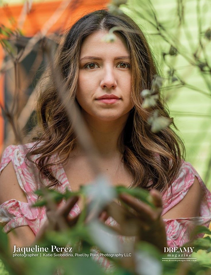Dreamy Magazine page of published photography work, female portrait photograph through plants.