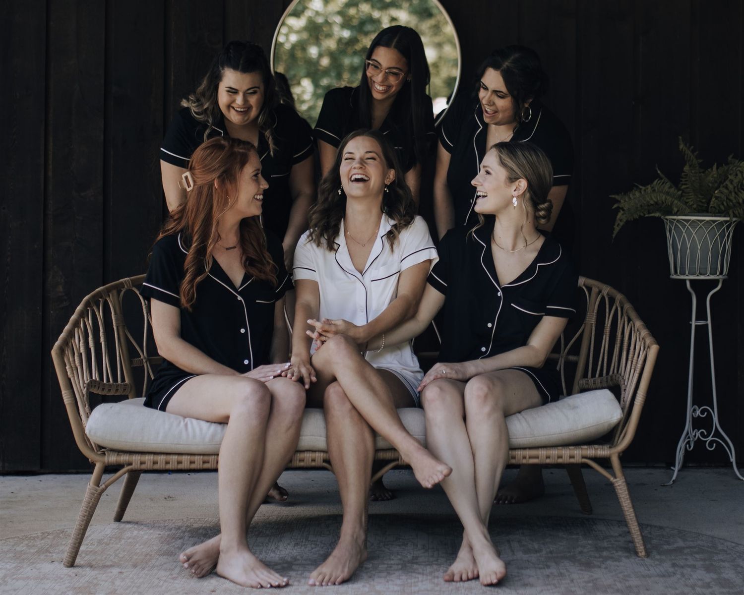 bride and bridesmaids getting ready in suite of Carriage House wedding venue in Conroe, Tx