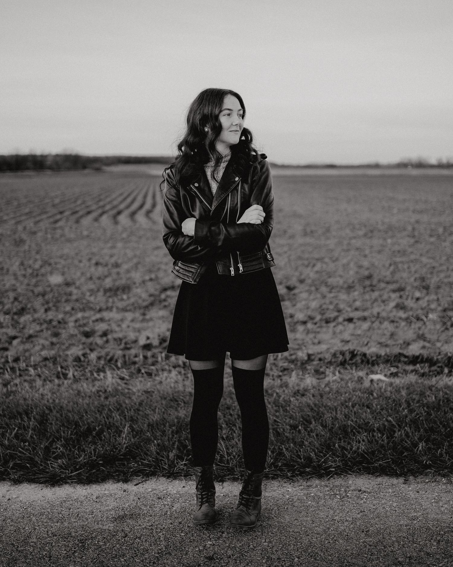 Mellissa, associate photographer, portrait in a field.