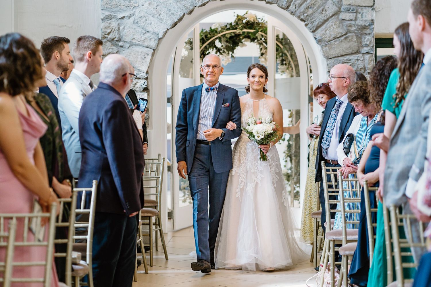 bride and father walk down aisle