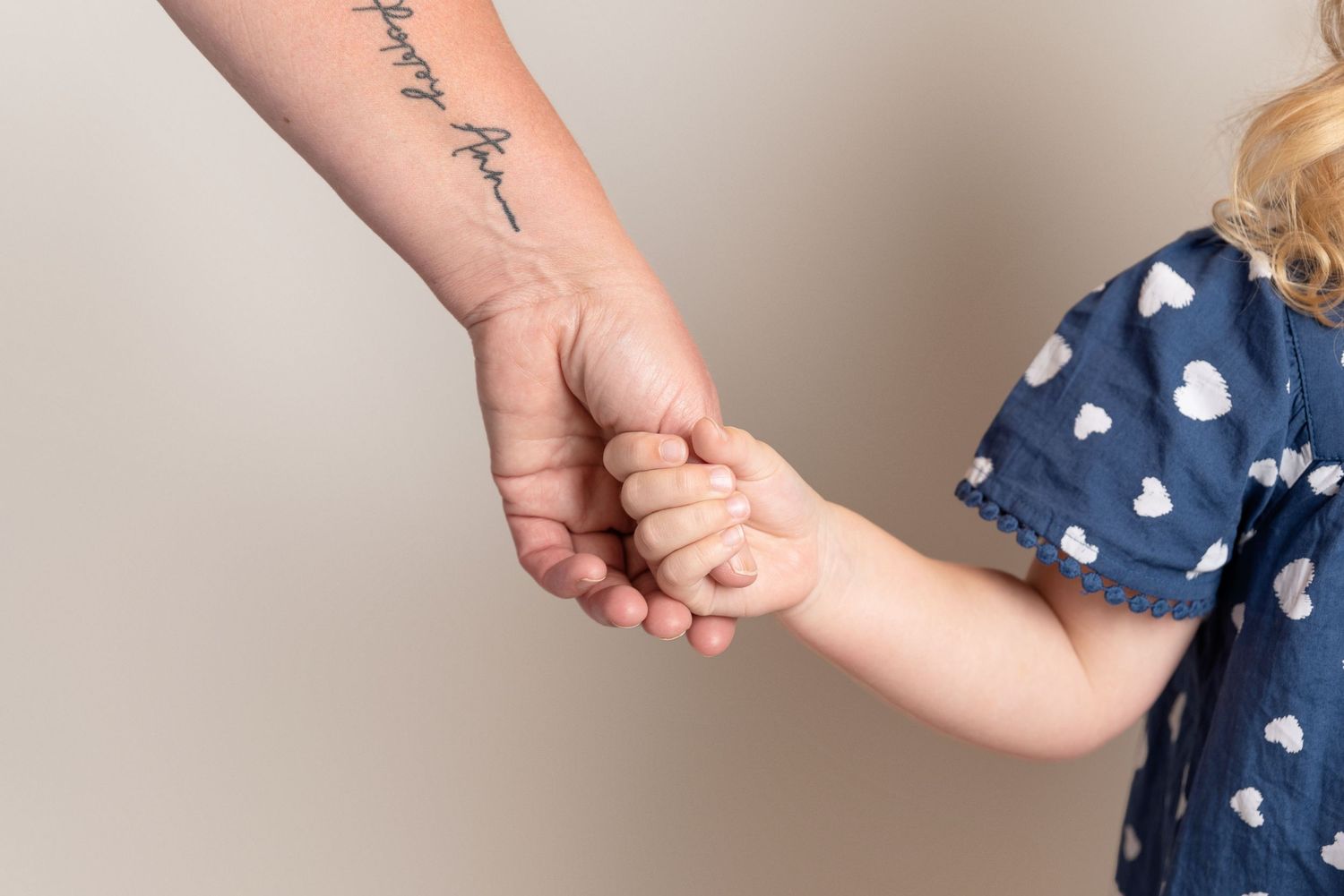 Mini Me holding hands