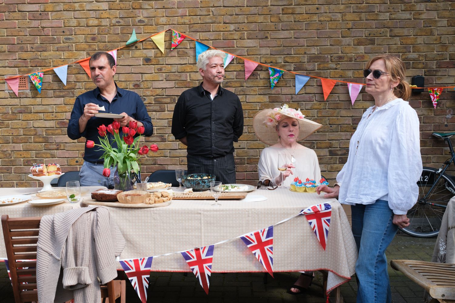 Neighbours enjoy a coronation street party in London.