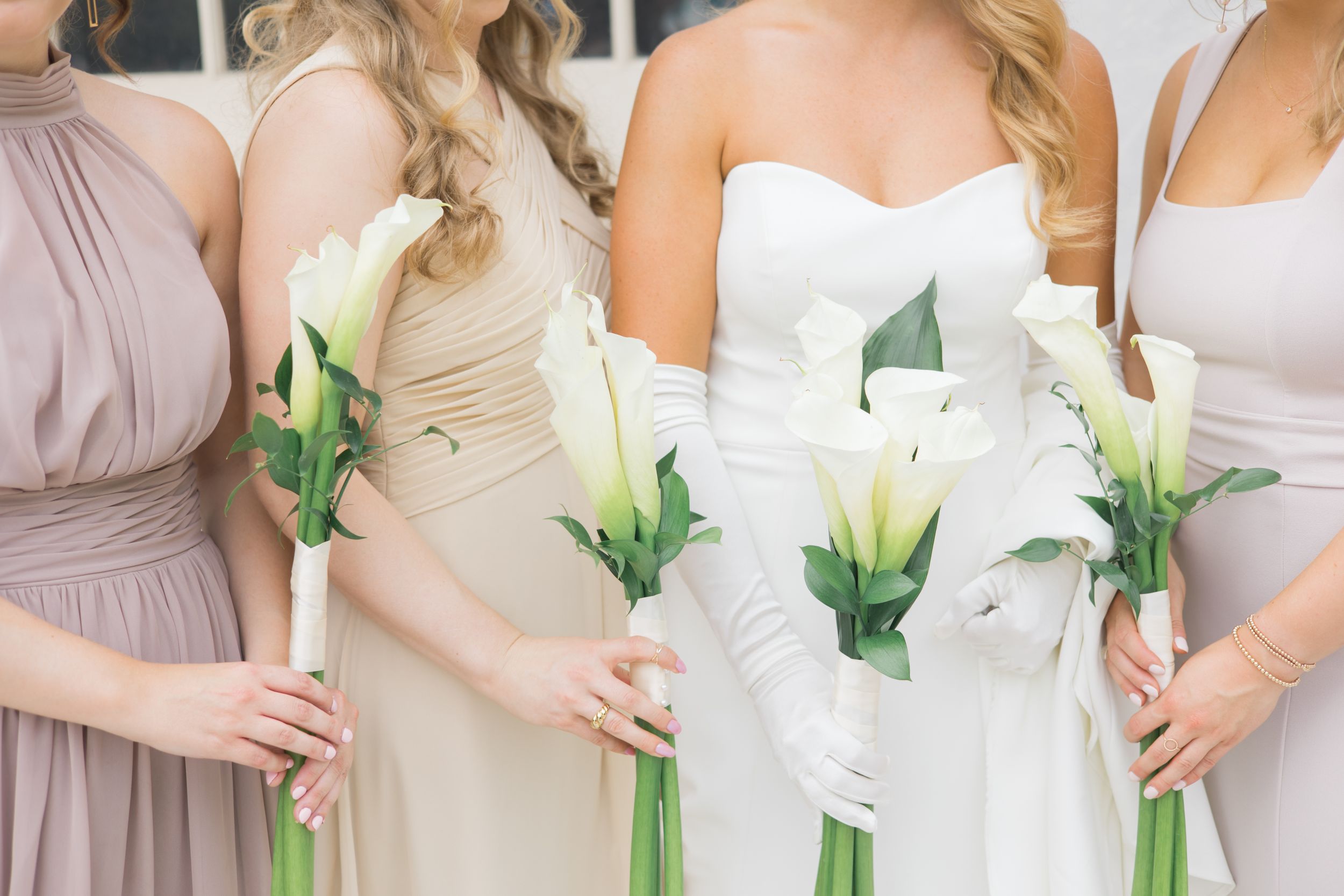 Bridesmaids posing with flowers