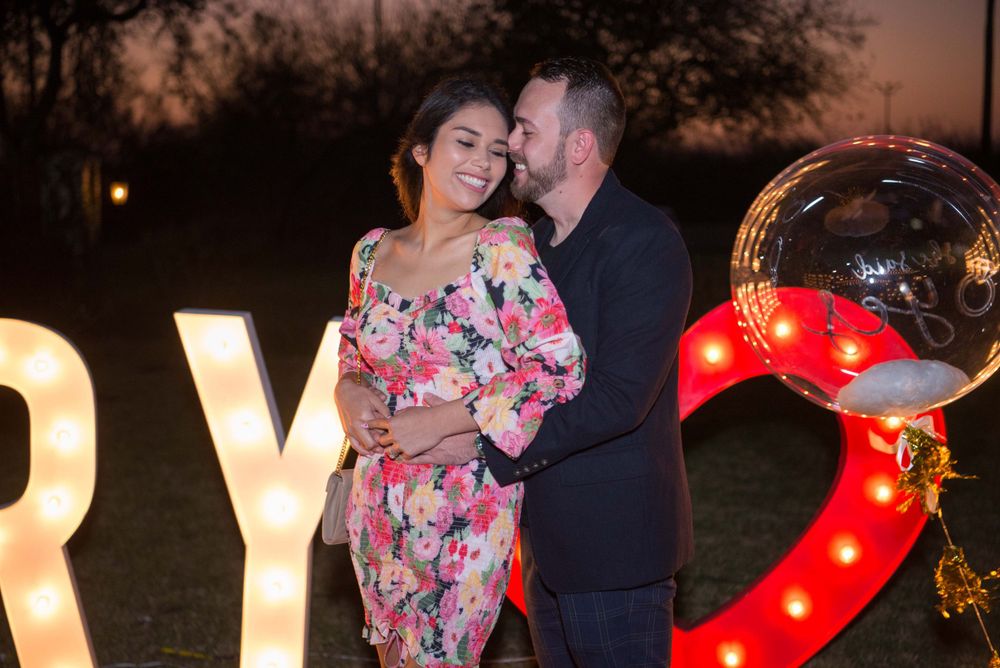 engaged couple. proposal. marry me big letters. Hacienda Las Mariposas. McAllen, Texas. Wedding photographer