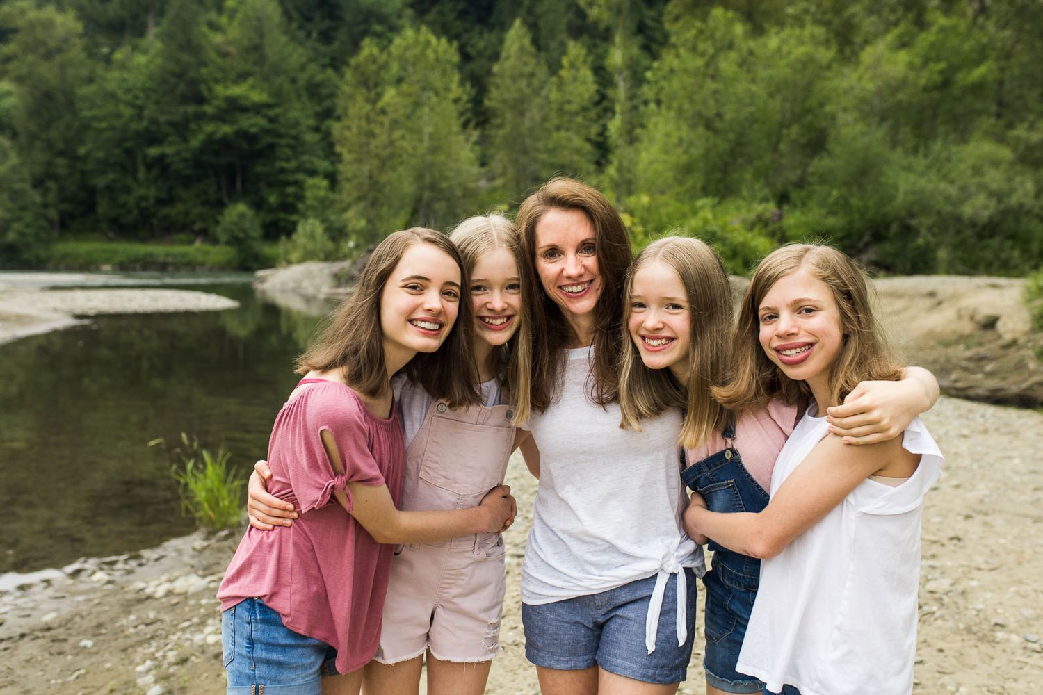 Mother and daughters hugging in Tolt McDonald photography session