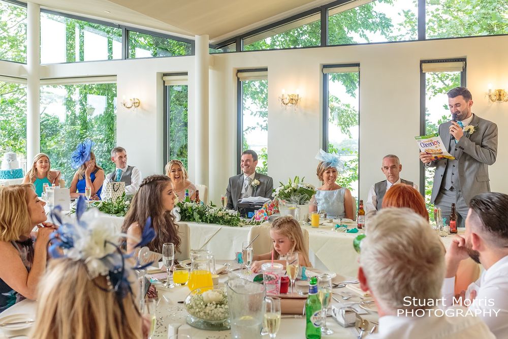 Wide shot of the west tower country house ballroom during the wedding breakfast.