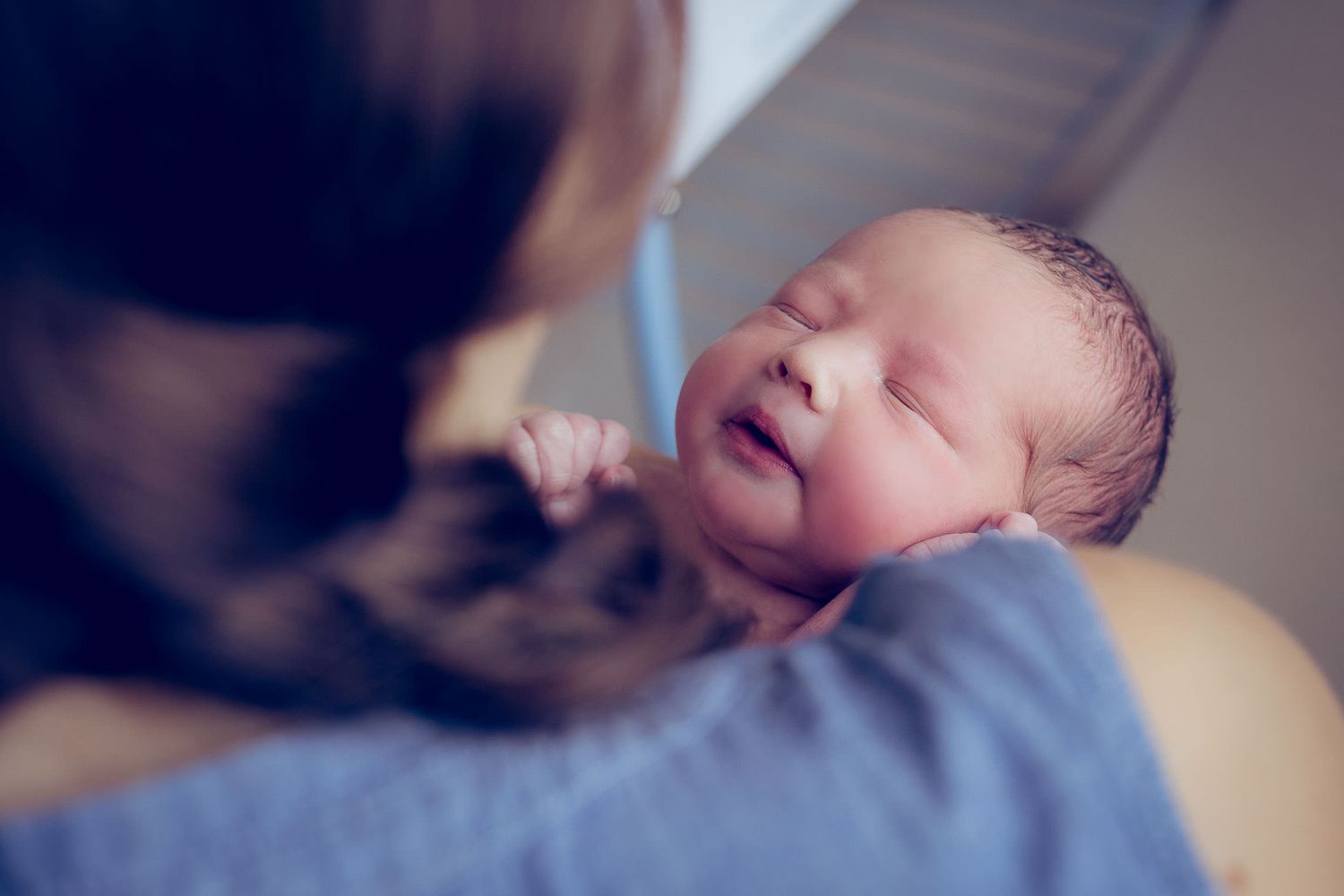 one day old baby in mother's arms in Parkview hospital in Dubai