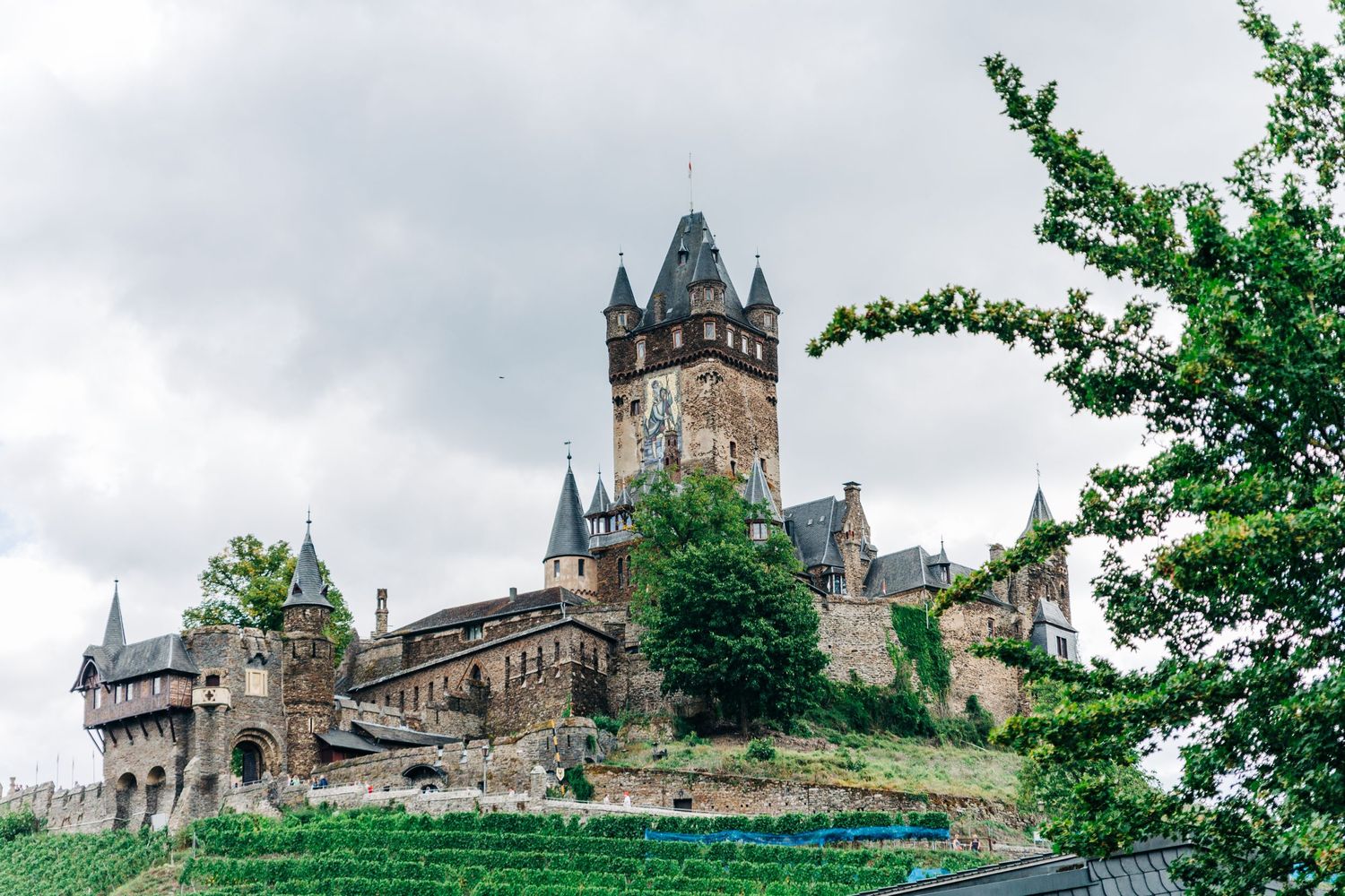 Cochem Castle perched on a hilltop overlooking the Moselle River in Germany.