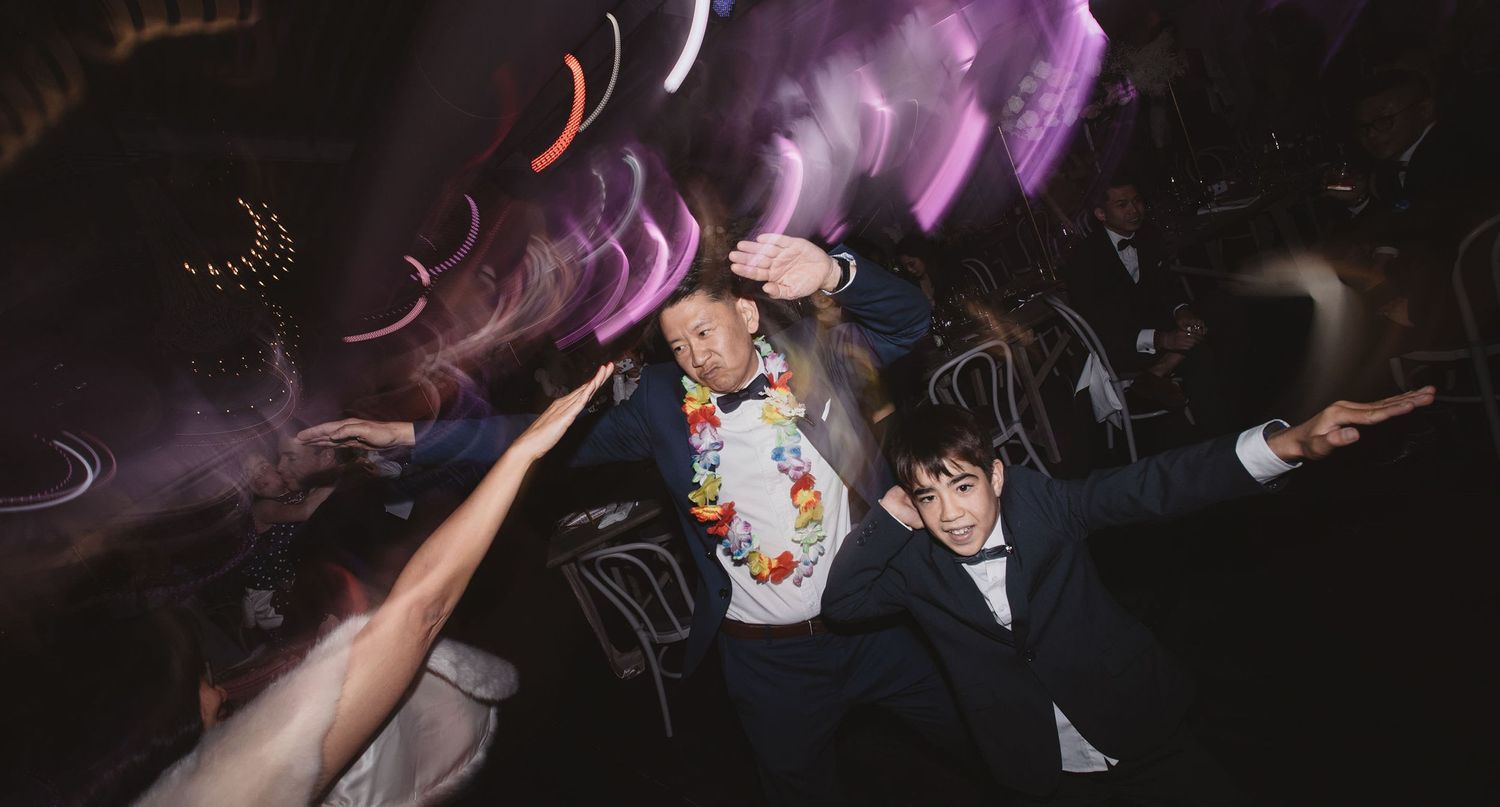 man dancing with boy in a wedding after party