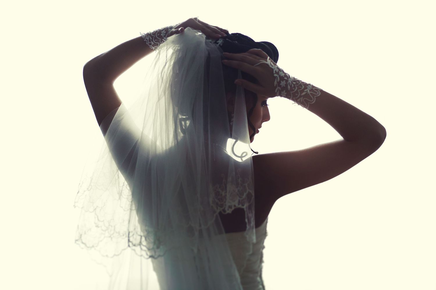 Backlit photo of a bride and her veil - by Gavin Horrell Photography, South West England