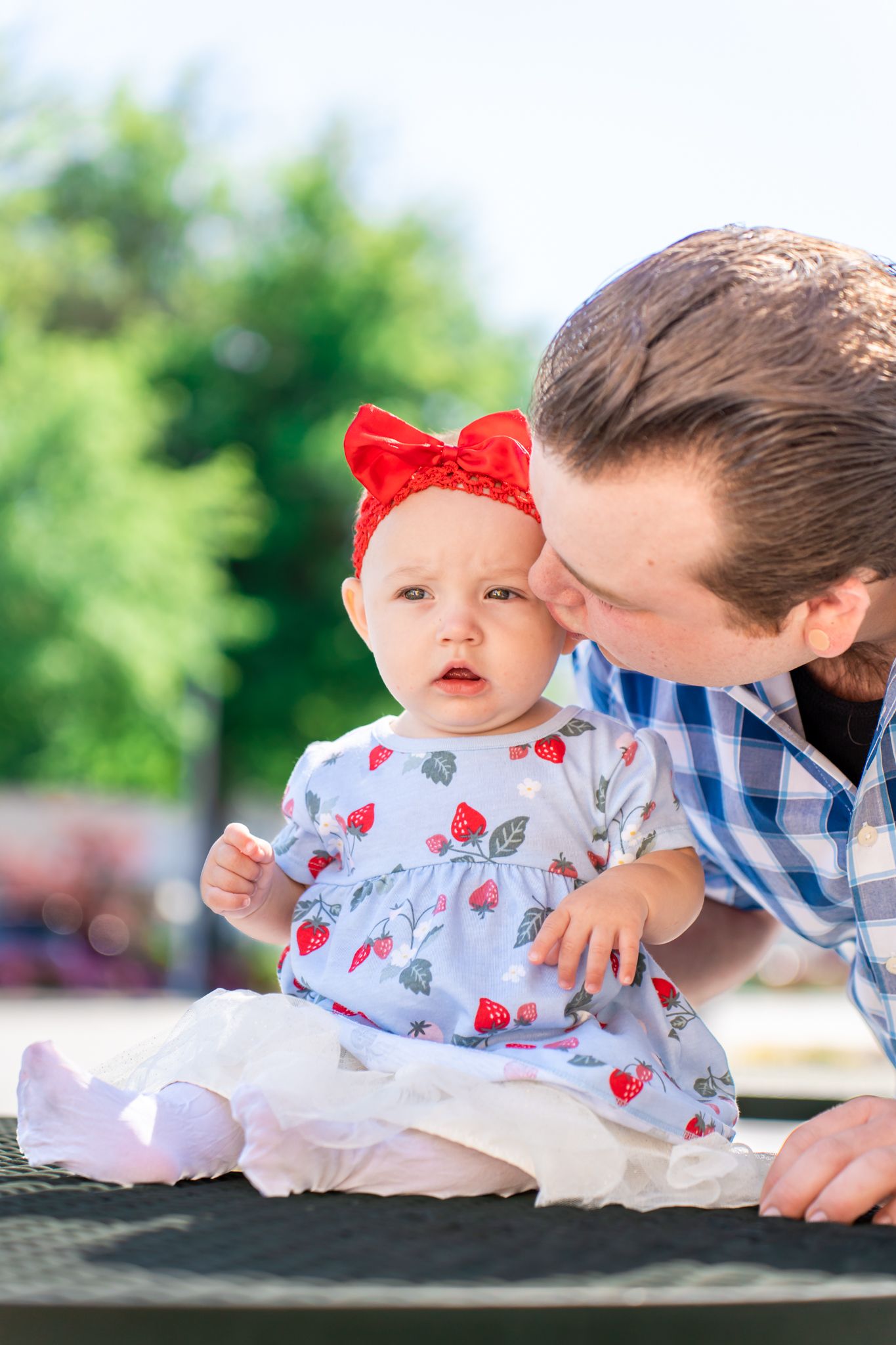 dad kissing baby girl