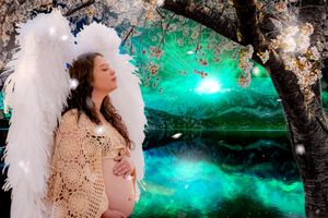 Ethereal winter scene with glowing turquoise lights and snowy branches.