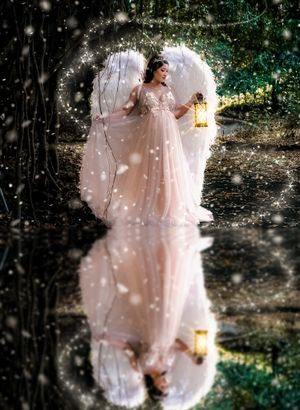 Enchanting forest scene with pink flowing dress and lantern creating magical atmosphere.