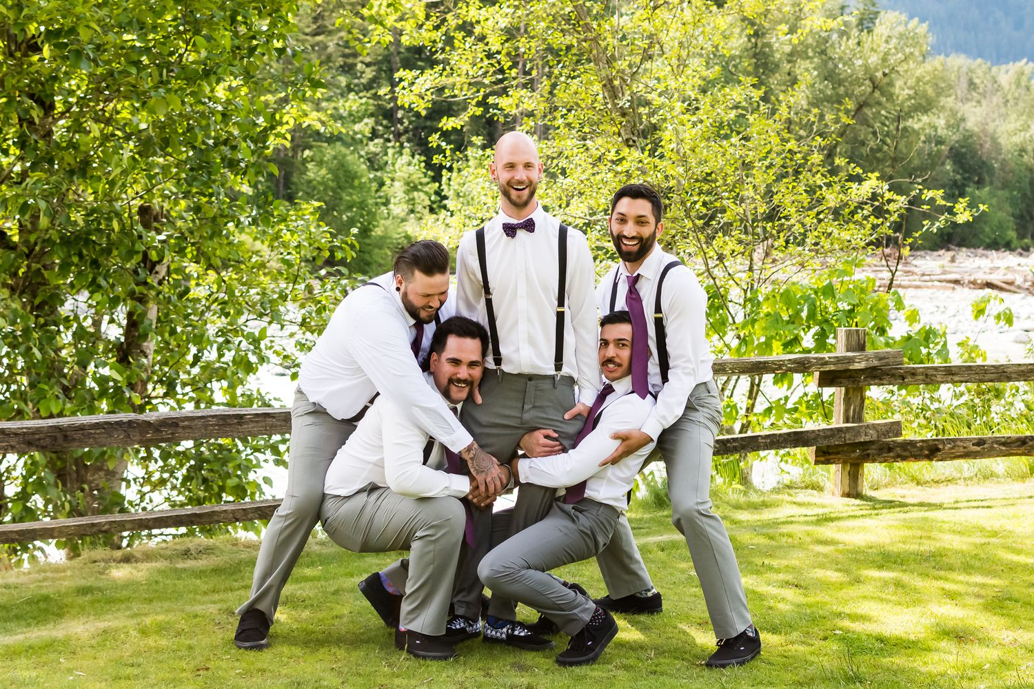 Groomsmen joke around with the groom on Hope Golf Course. Photo by Kari Mills Photography.