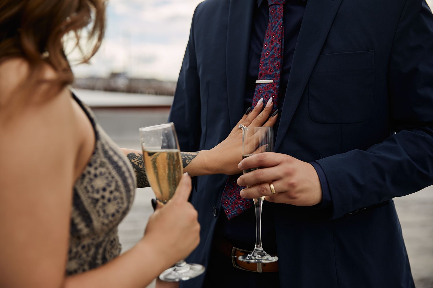Elegant wedding reception guests toasting with champagne glasses.