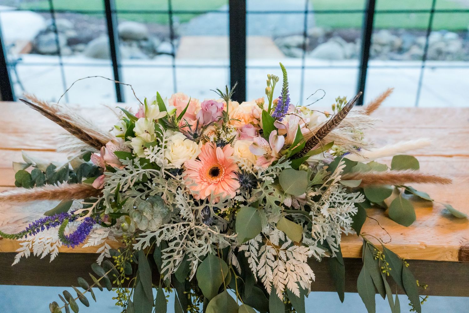 floral table piece with window in the background