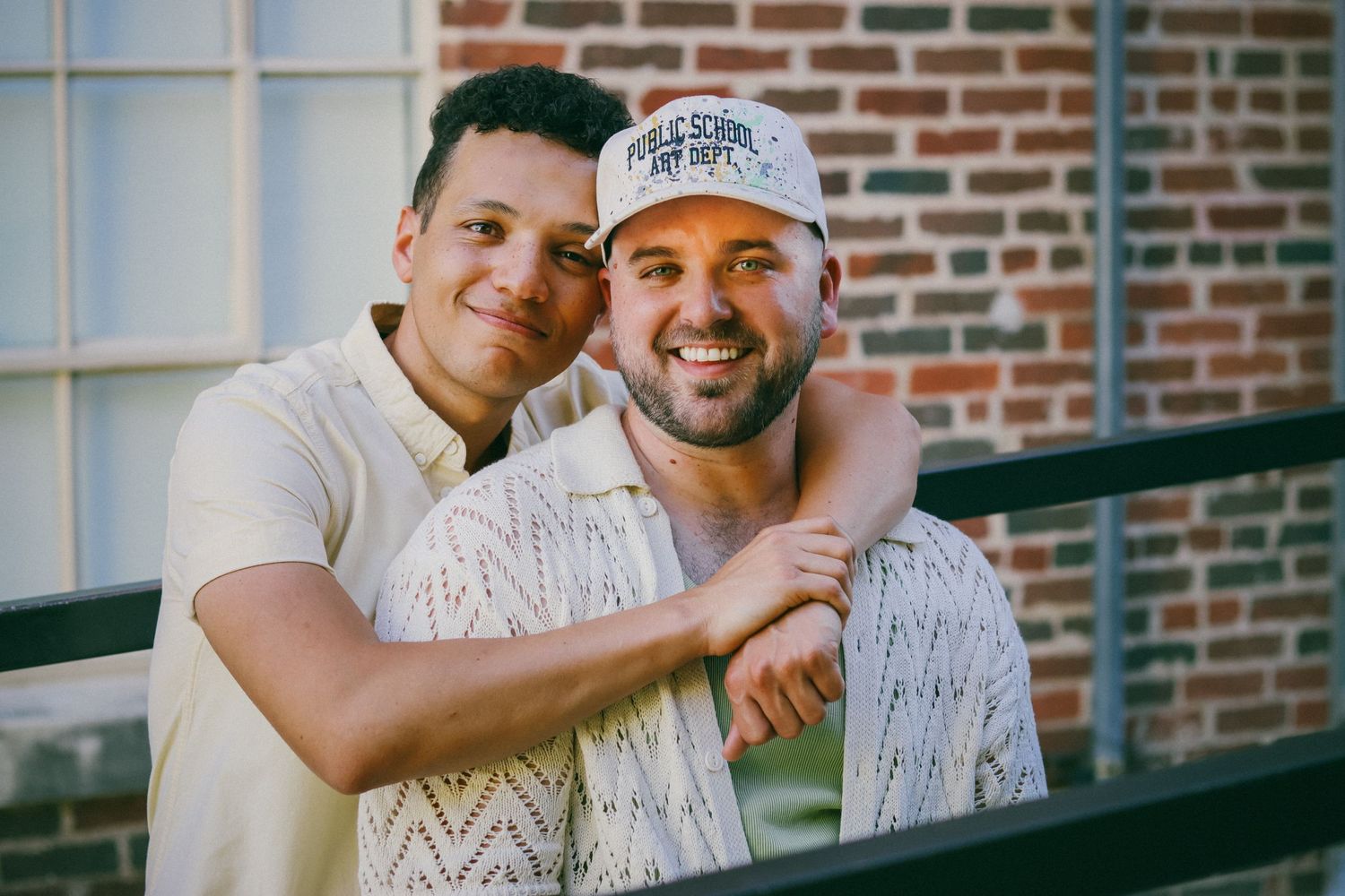 An LGBTQ couple embracing while getting their engagement photos taken in Fort Worth, Texas.