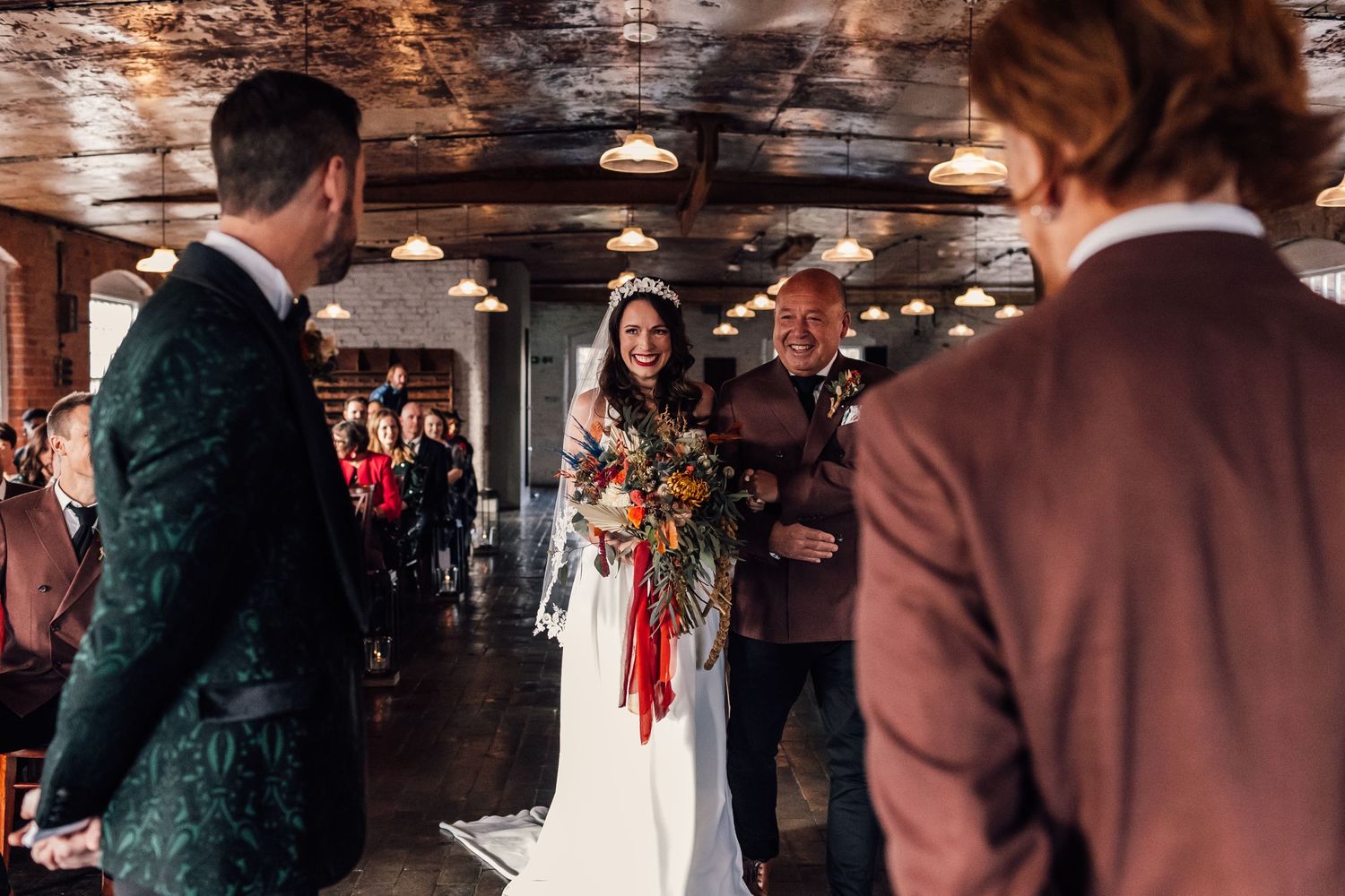 bride walking down the aisle with her dad