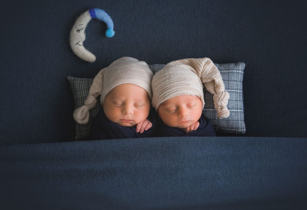 Sleeping twin boys blue