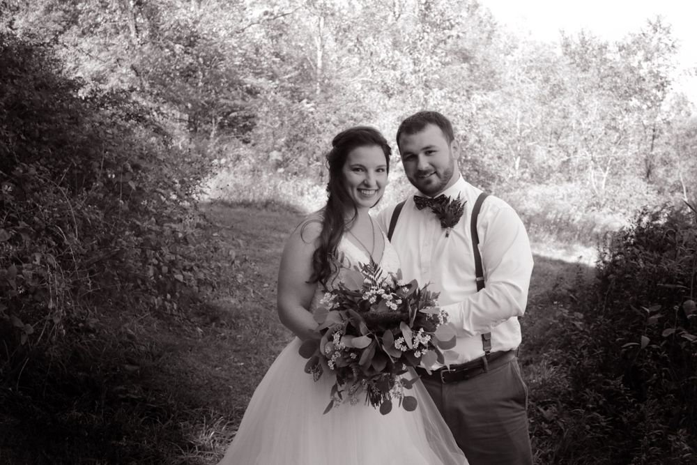 b&w formal outdoor wedding photo bridal flowers