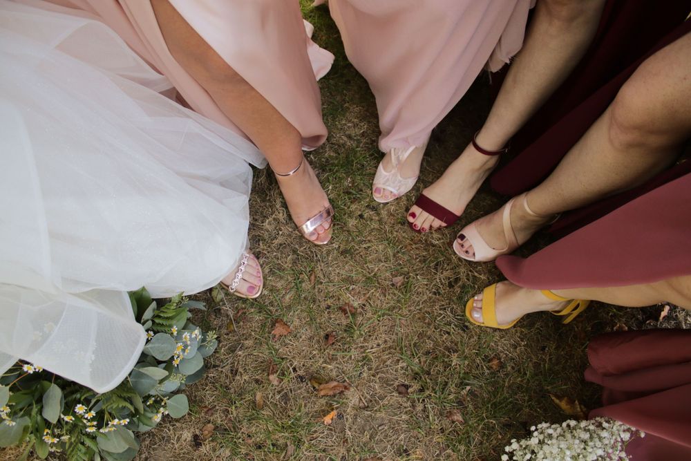bridesmaids shoe detail photos flowers wedding day outdoor natural pink