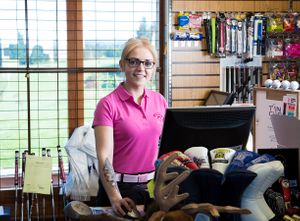 golf club assistant behind the counter