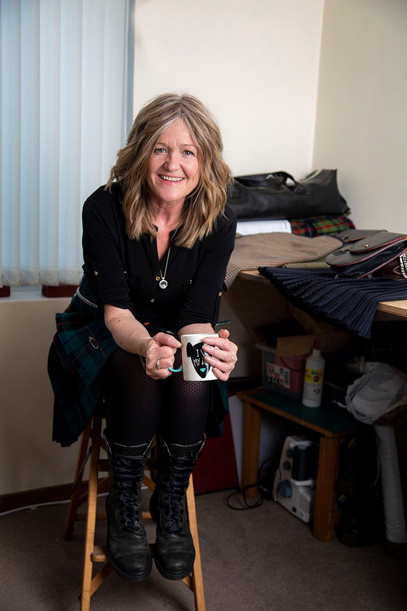 lady holding a cup of coffee