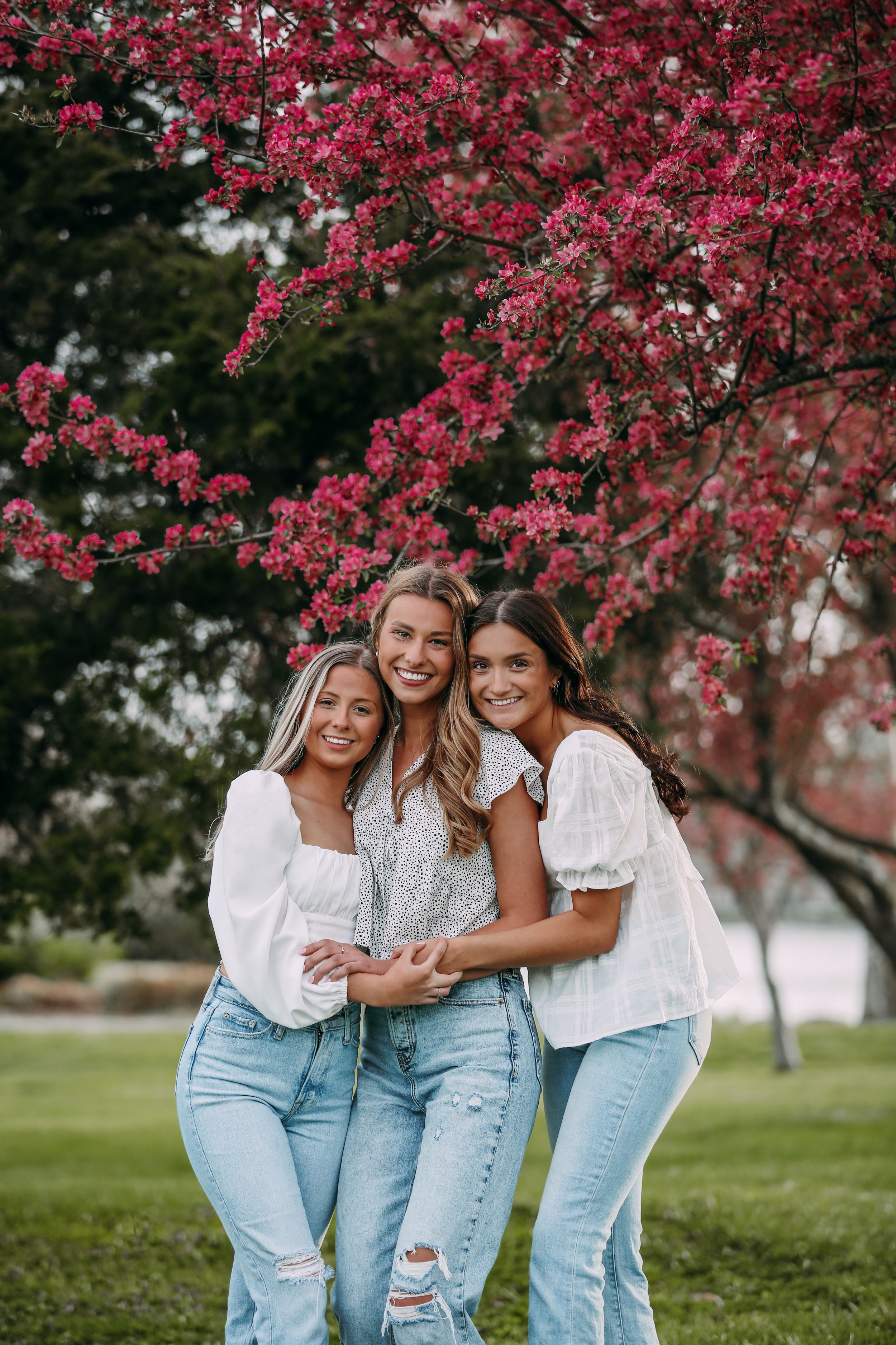 girls in a spring pink trees