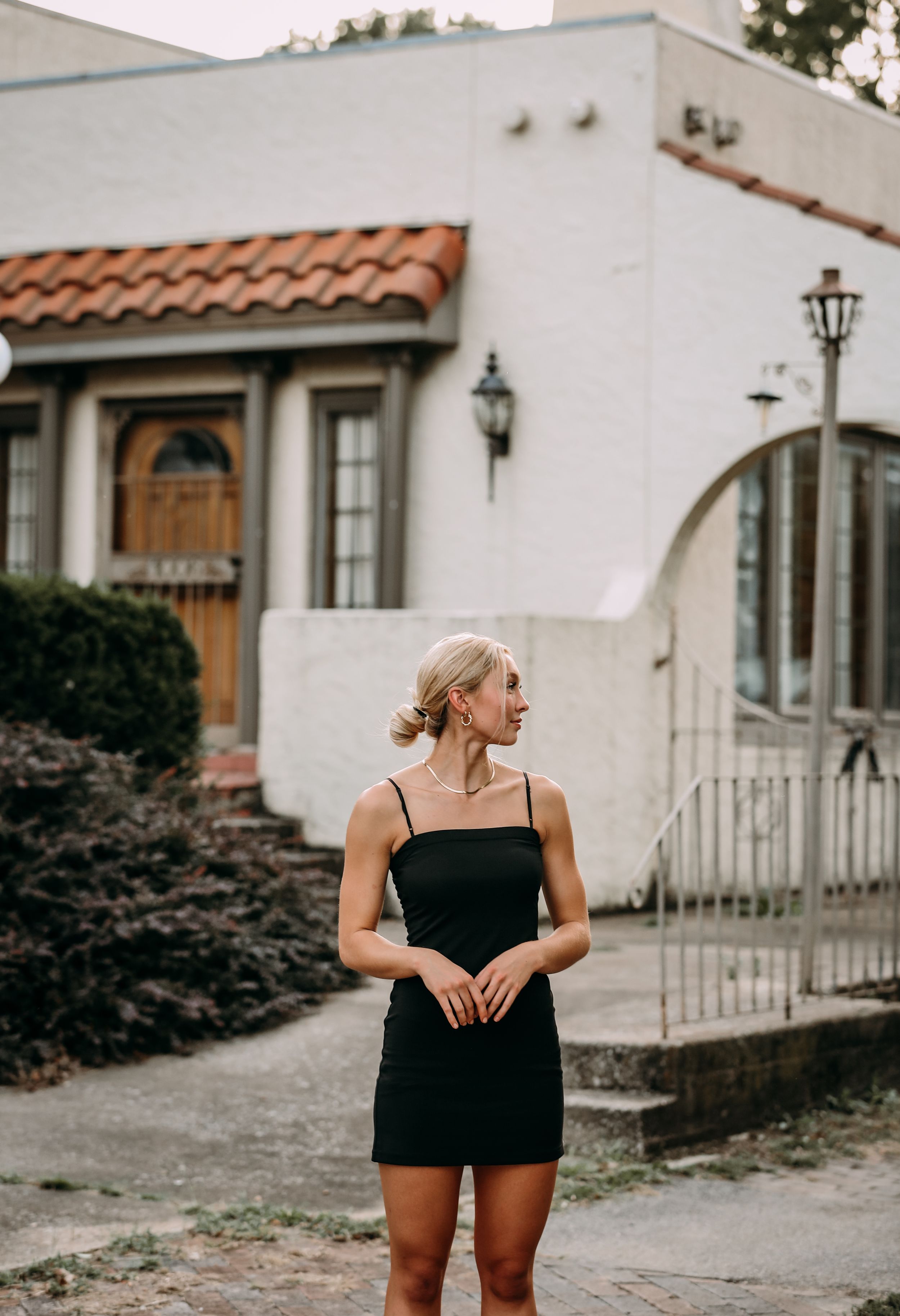 girl in front of old house
