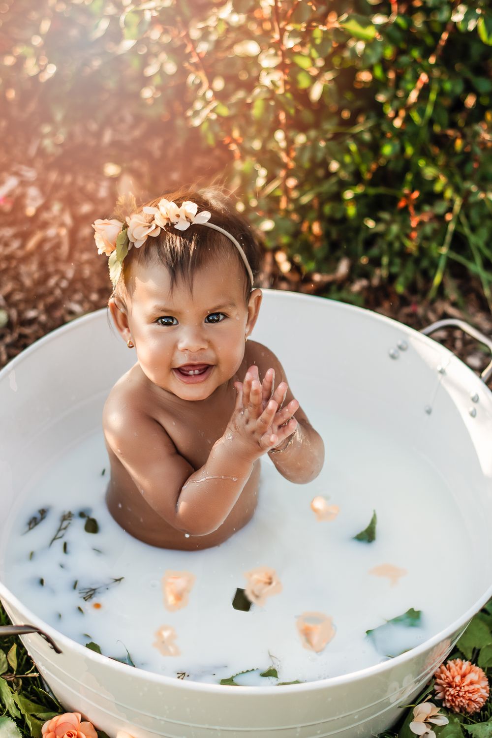Baby in 1 year milk bath in Littleton Memorial Rose Garden