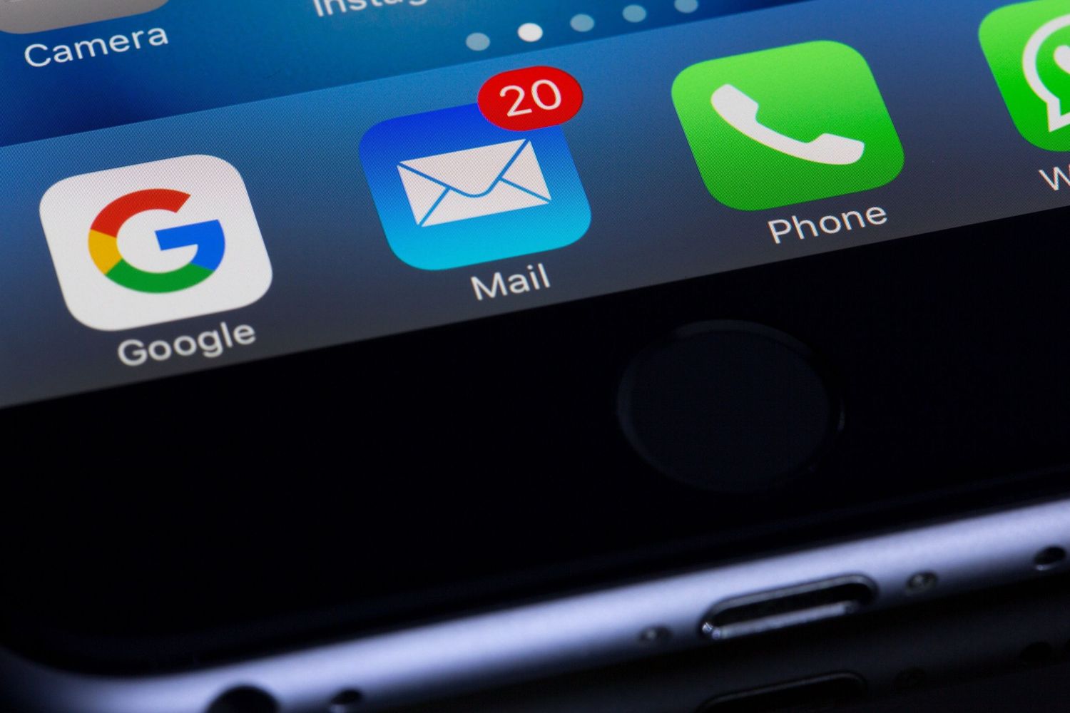 iPhone screen showing app icons for Google, Mail with 20 unread messages notifications, and Phone application.