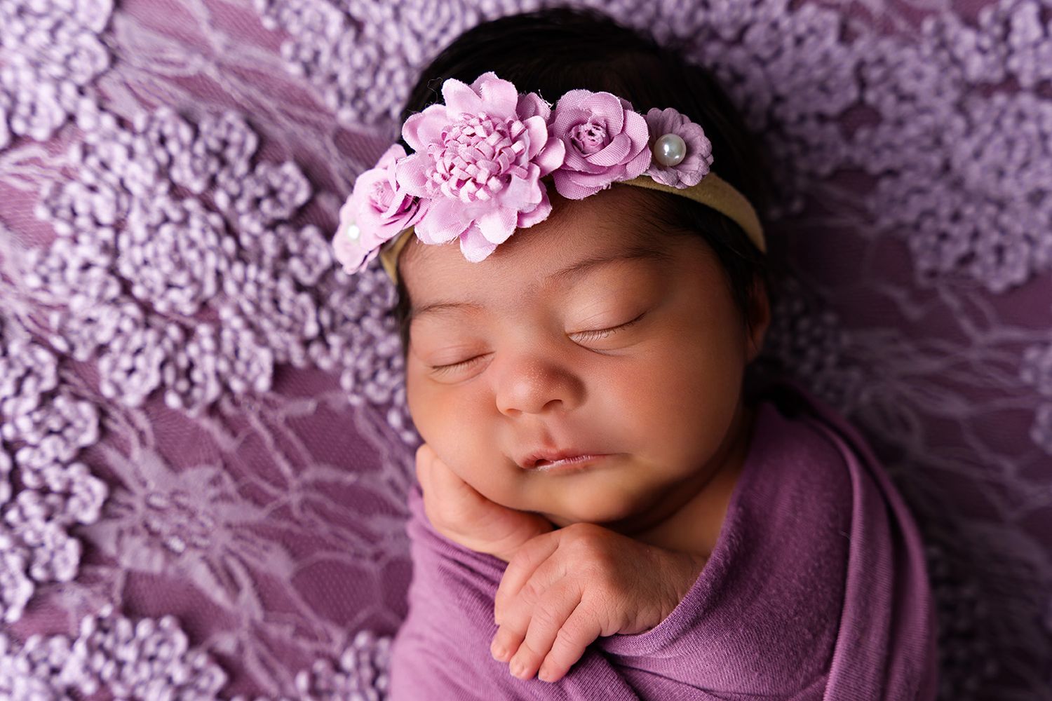 midland tx newborn photographer studio newborn session posed newborn photo session newborn purple wrap photographers midland tx wrapped baby