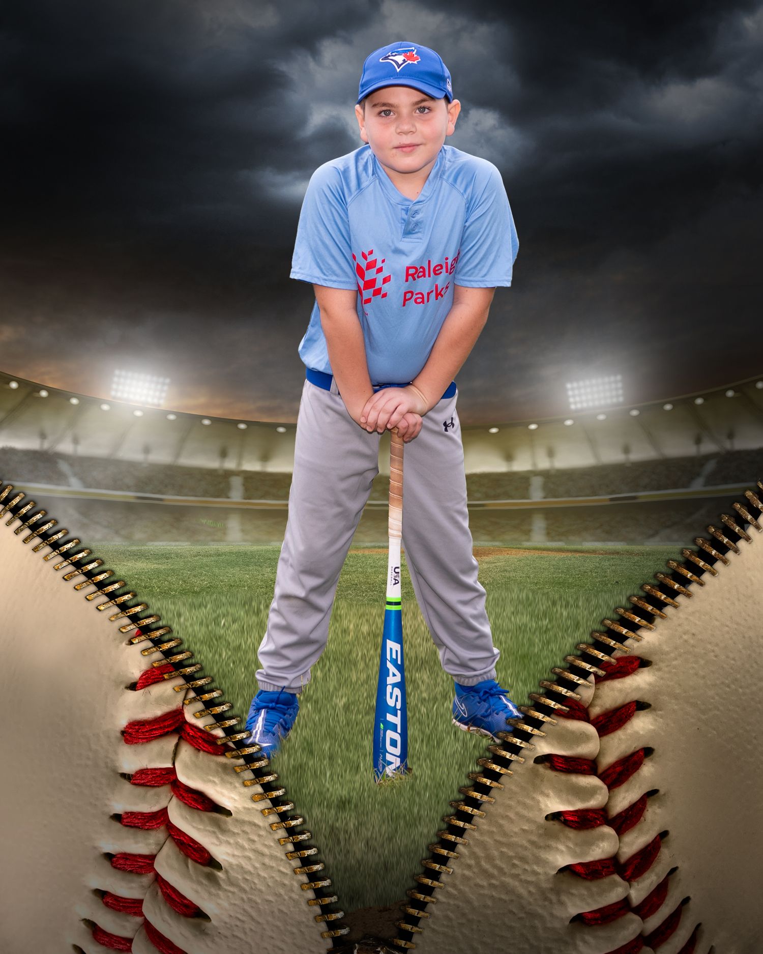 Youth baseball player posing on creative baseball field background with dramatic sky.