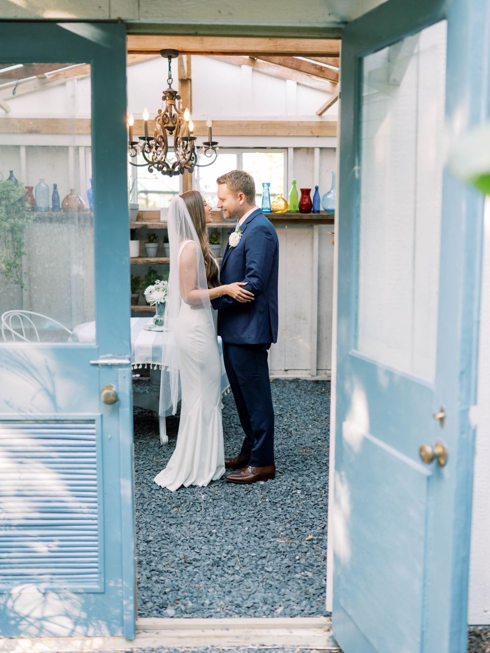 wedding photo of a couple dancing in a greenhouse