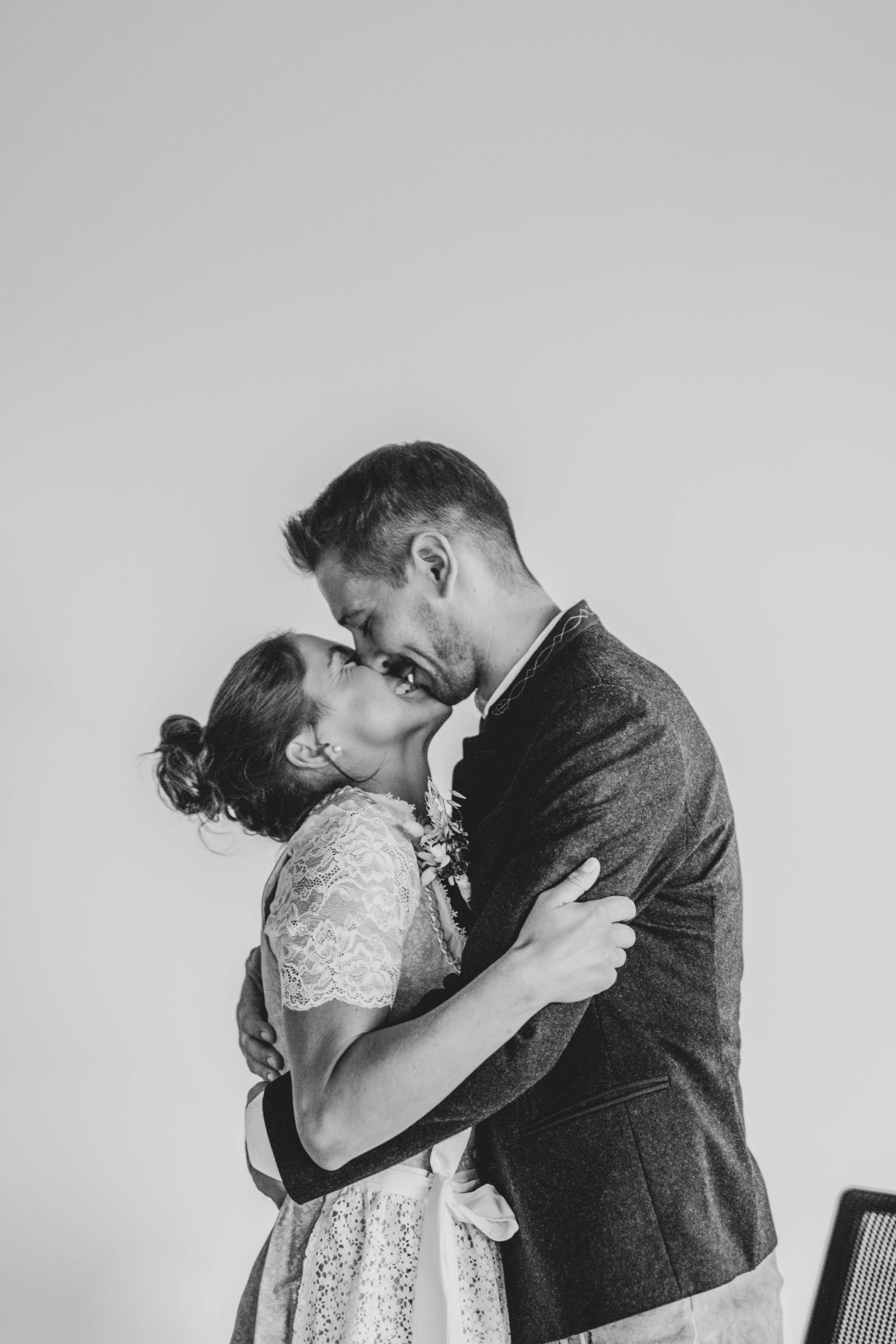 A romantic black and white photo sequence of a couple sharing tender moments together.