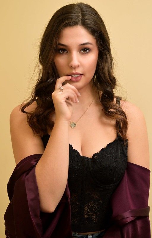 picture of young woman standing up posing
