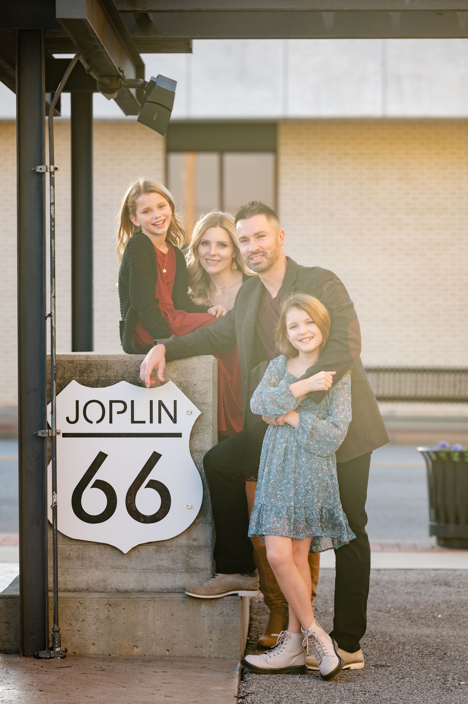 A family group poses together by a Route 66 sign in Joplin.