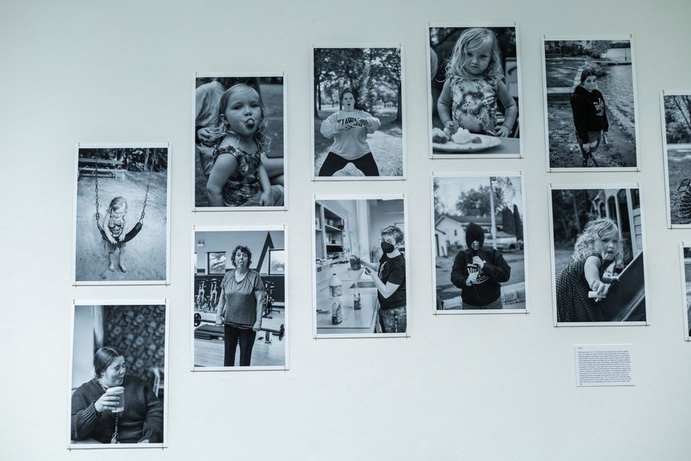 Grid display of black and white photographs showing various candid moments and activities.