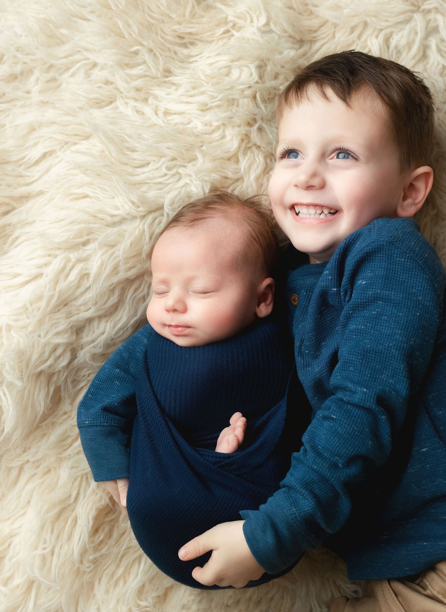 Big brother with newborn brother. Greenville sc newborn photographer, Easley sc newborn photographer, Upstate newborn photographer.