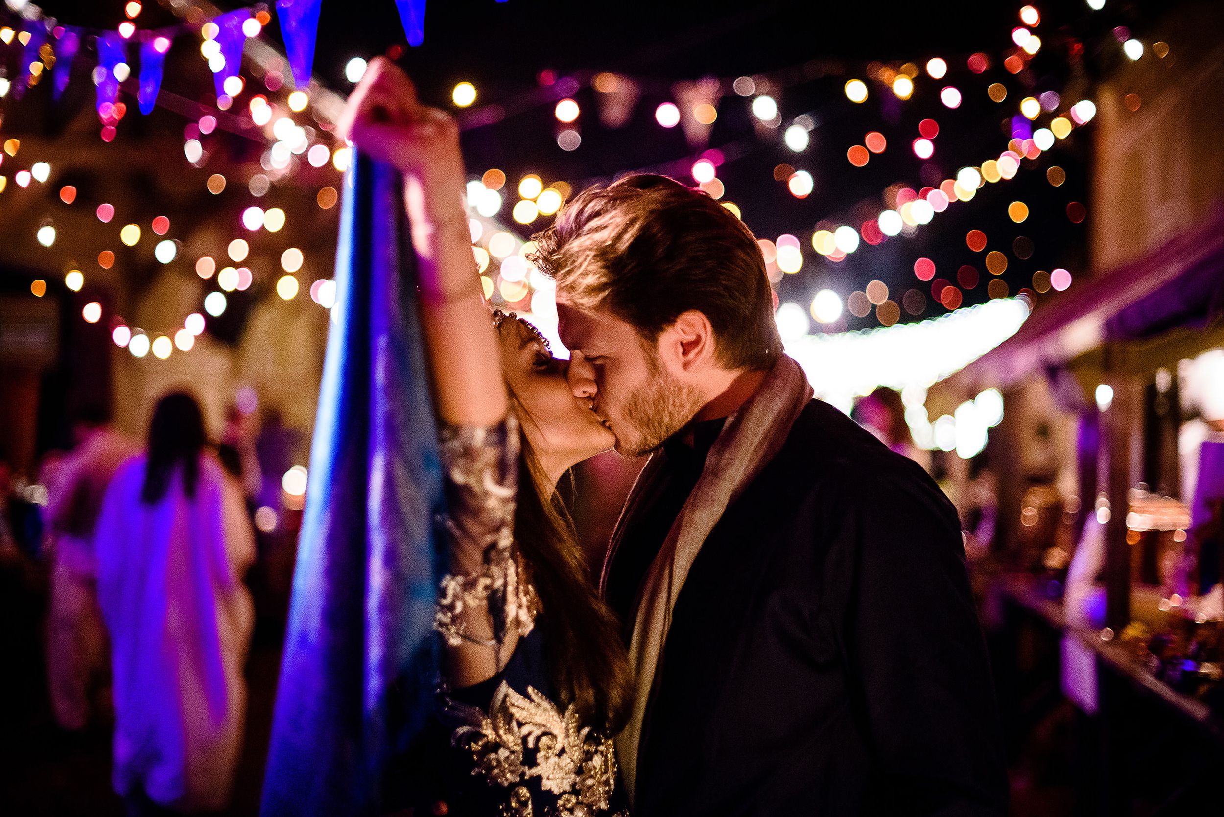 Romantic evening celebration under twinkling string lights creating a magical atmosphere.