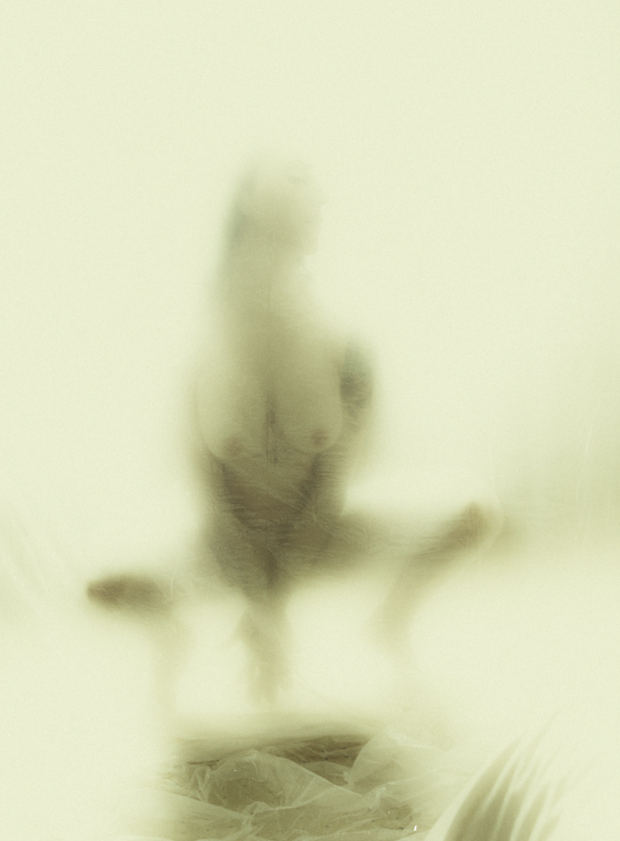 Artistic photograph with glowing green light effects creating ethereal atmosphere.