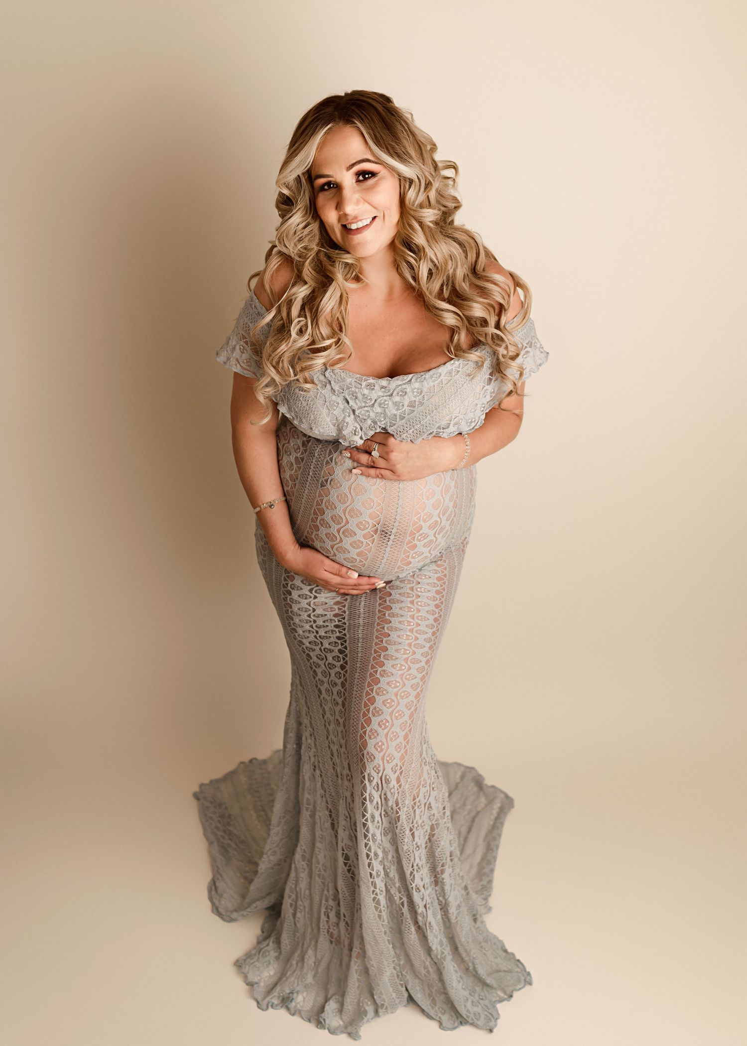 Riverside CA maternity pictures, pregnant woman posing in gray maternity dress