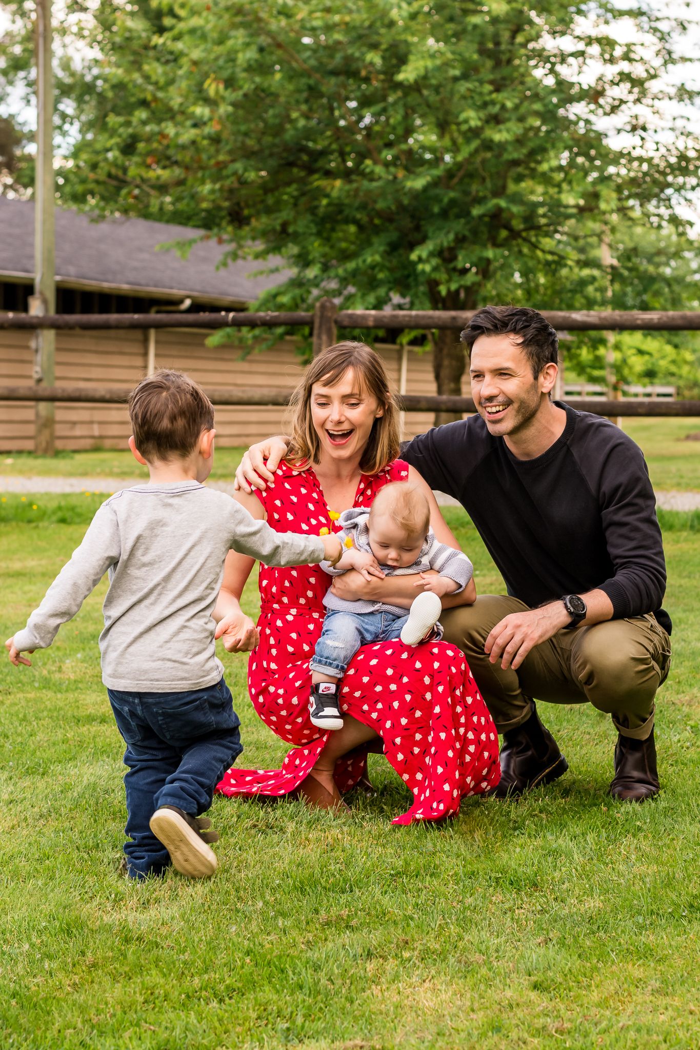 Family portrait session, little boy picking flowers, happy smiling family, family pictures