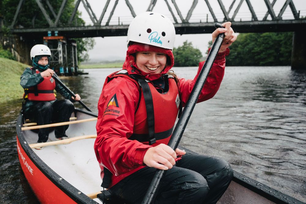 My Adventure canoe students begin to paddle on river