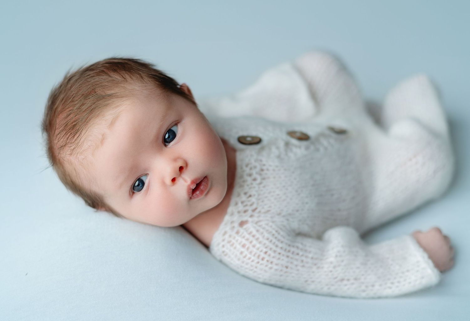 A newborn session with the baby in white outfit. Greenville SC newborn photographer, Easley, SC newborn photographer, Upstate SC newborn