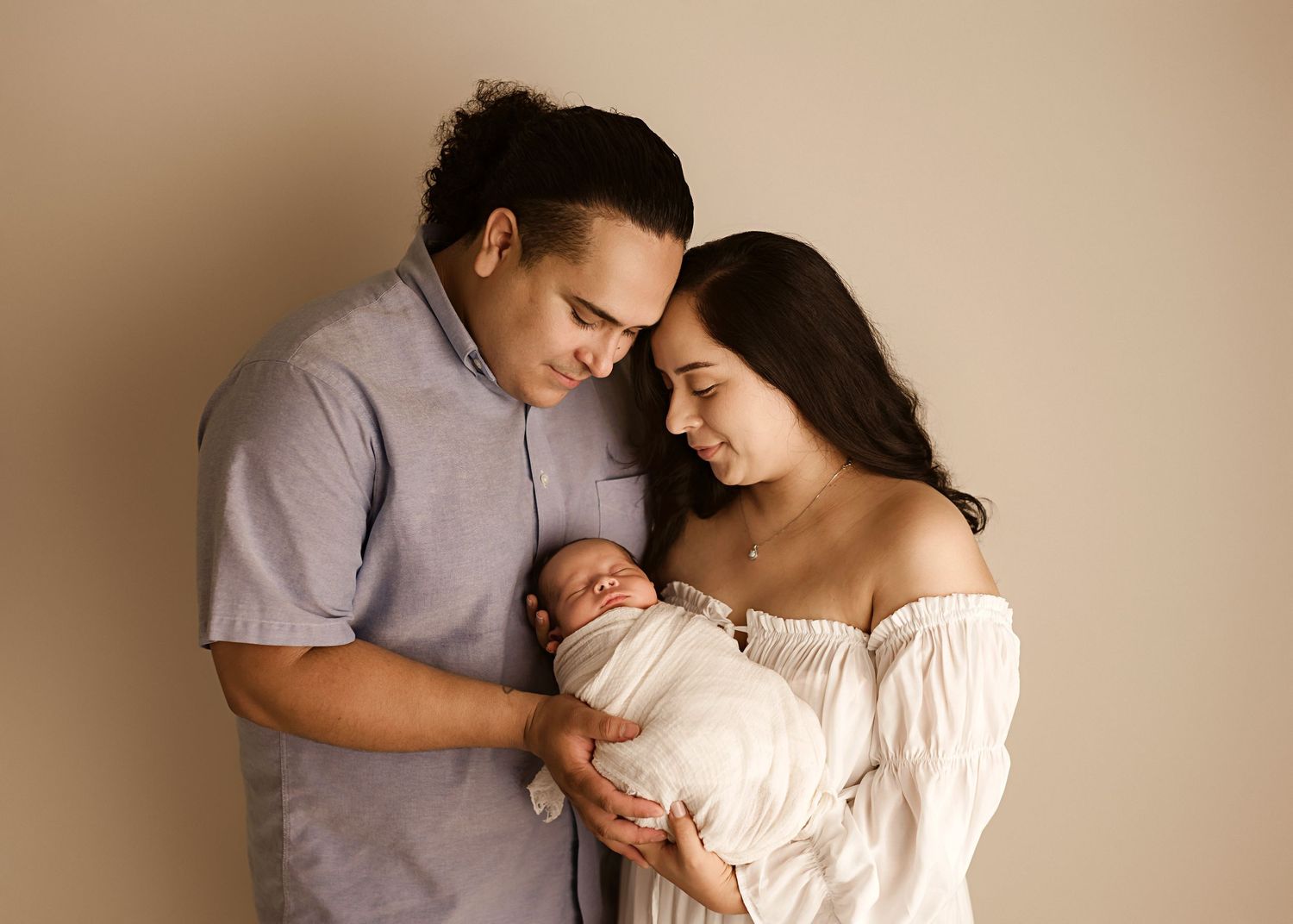 newborn photographer in Moreno Valley CA, studio photoshoot with baby and parents