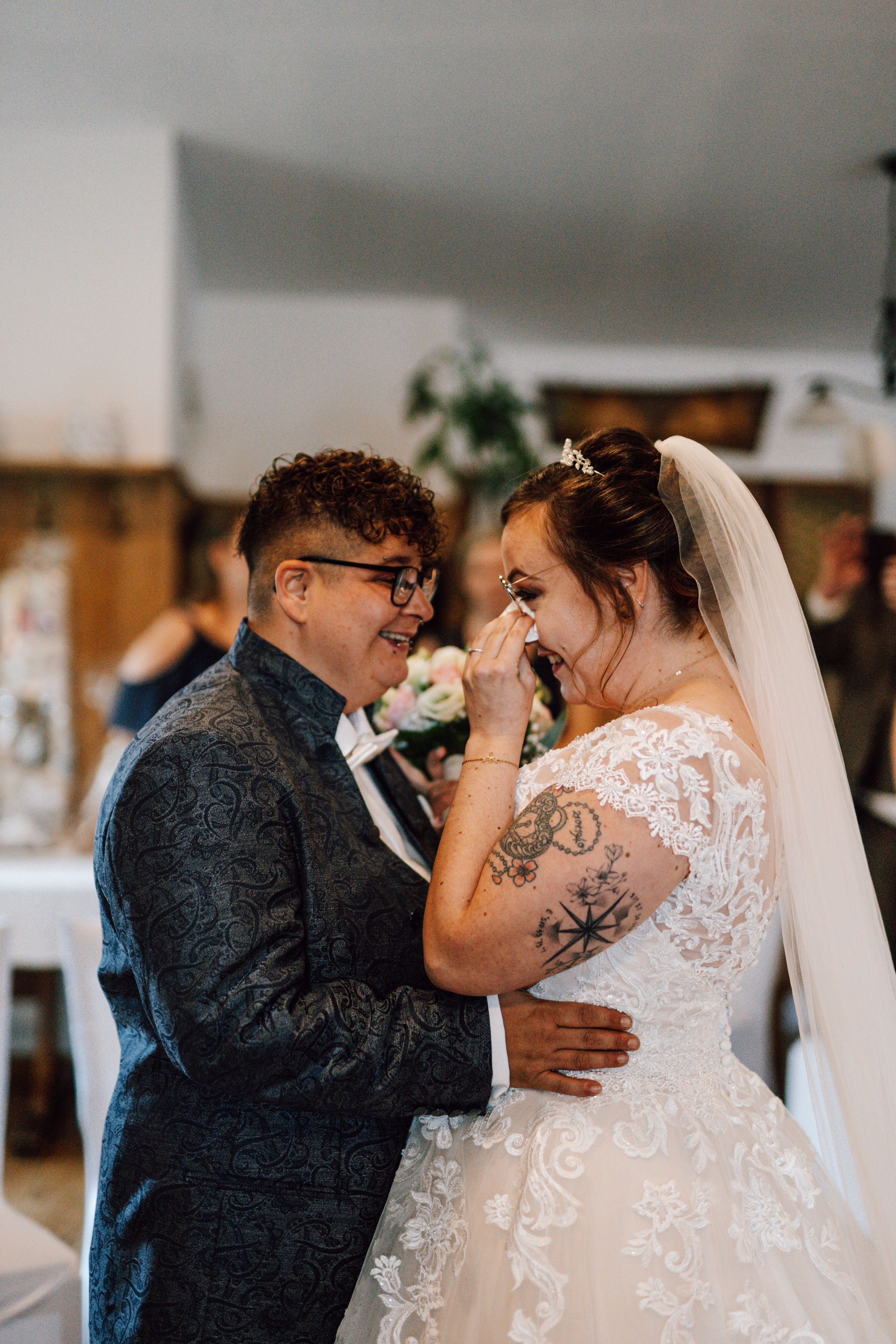 Emotional moment shared between couple during wedding ceremony.
