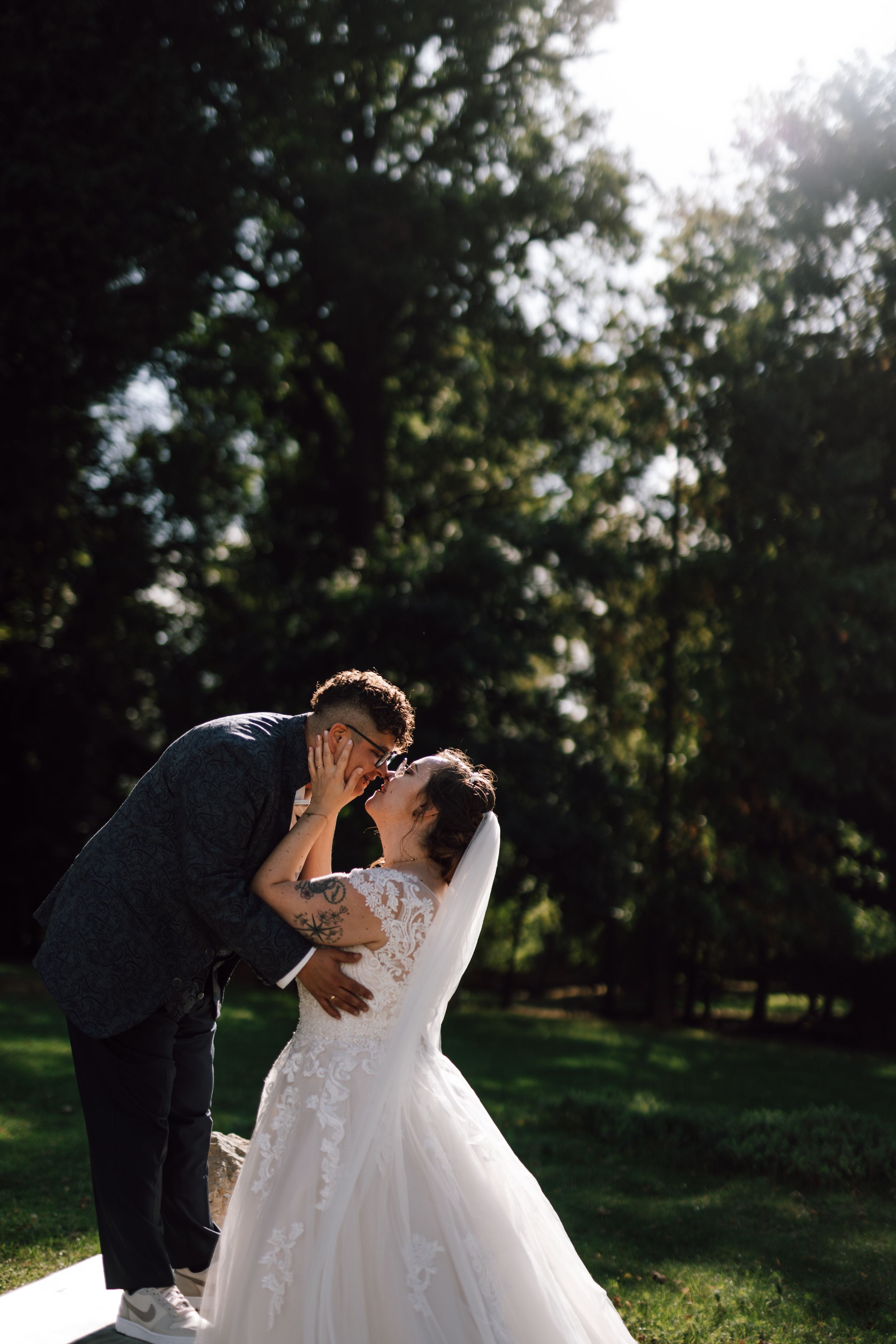 A romantic wedding photo sequence captured in sunlit garden setting.