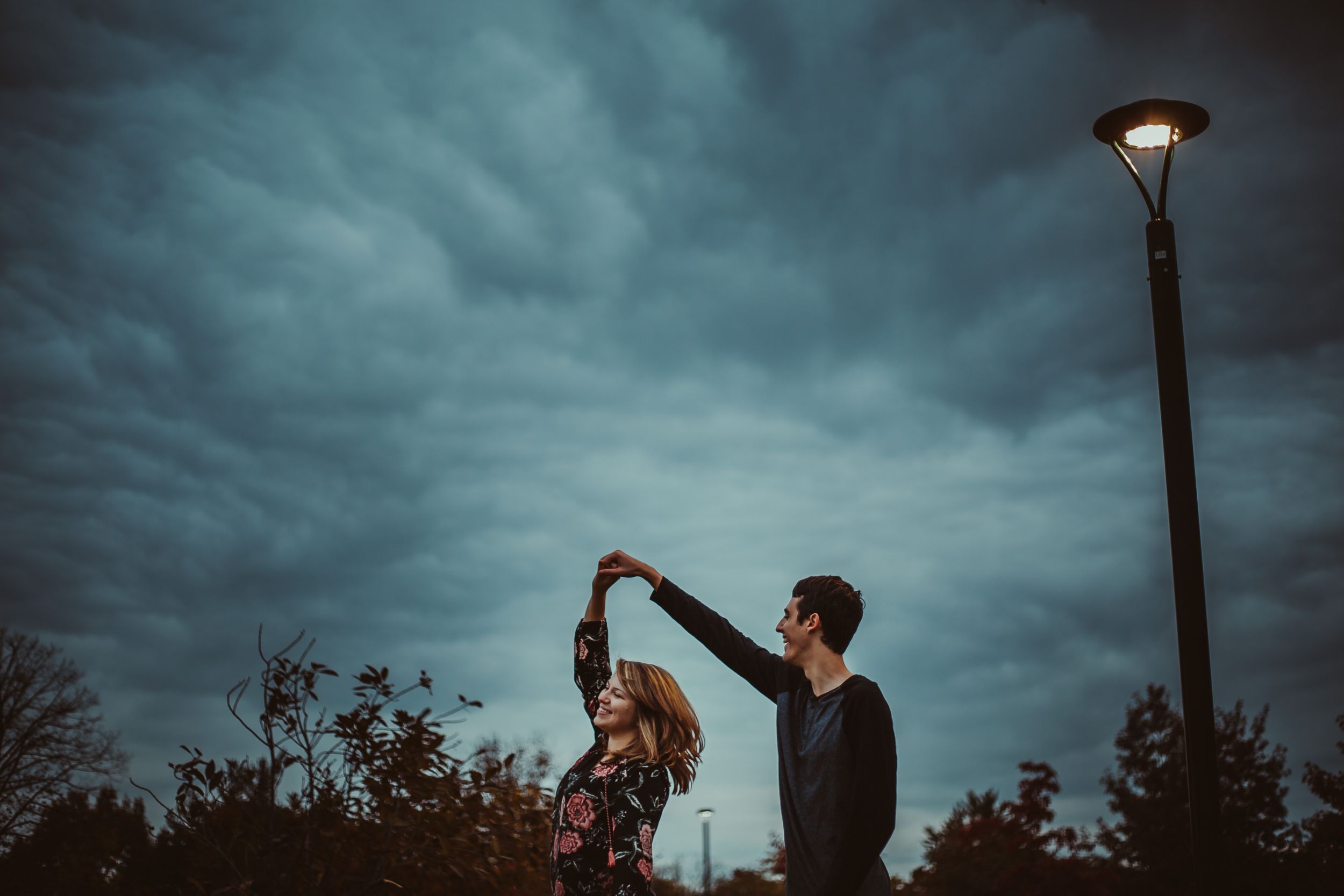 Rainy day engagement session with street light lamp post, fall couples  cinematic storytelling photography