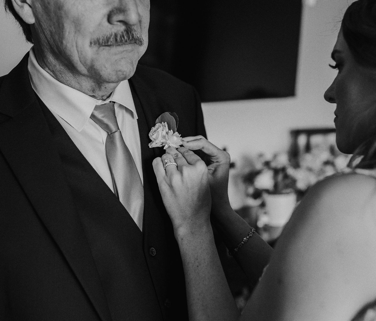 E Noelle Photography in-home wedding in Hidden Hills Los Angeles, bridal orange, bride putting boutonniere on dad